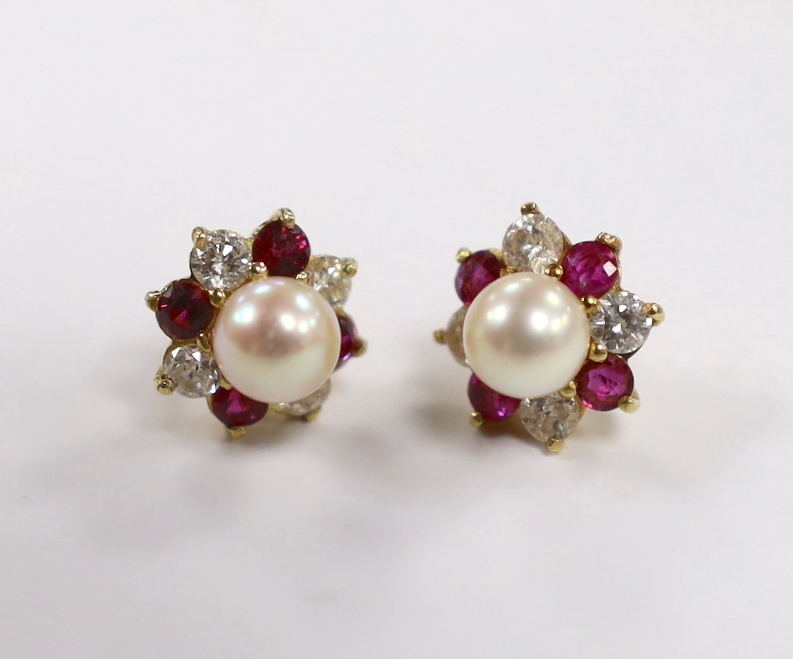 A pair of yellow metal, cultured pearl, ruby and diamond set flower head cluster ear studs (lacking butterflies), 11mm, gross weight 4.2 grams.